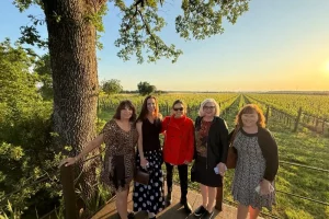 Chicca and Tuscan food and wine tour guests in front of Guado al Tasso vineyards