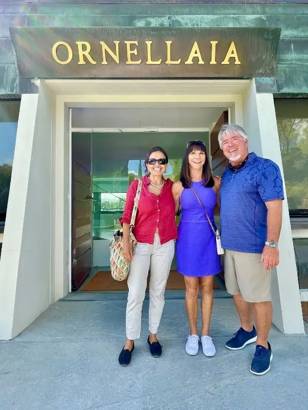 Chicca with tour guest at the entrance to the Ornellaia Estate Chicca with tour guest at the entrance to the Ornellaia Estate