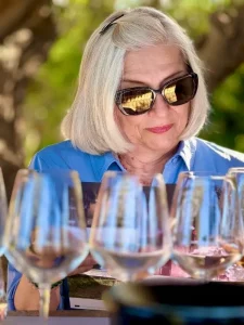 Tuscan food and wine trip guest waiting to taste different wines at Chiappini Winery Estate