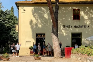 Tuscan food and wine trip guests before entering the Wine Argentiera Estate for wine tasting