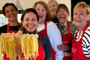 Chicca and guests making homemade pasta at home in La Casa Toscana