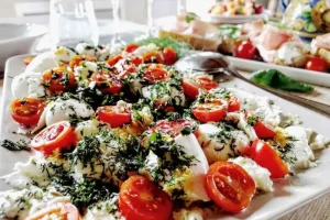Fresh fish with tomatoes basil and olive oil
