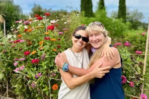 Guest with Chicca in the flower garden in Tuscany