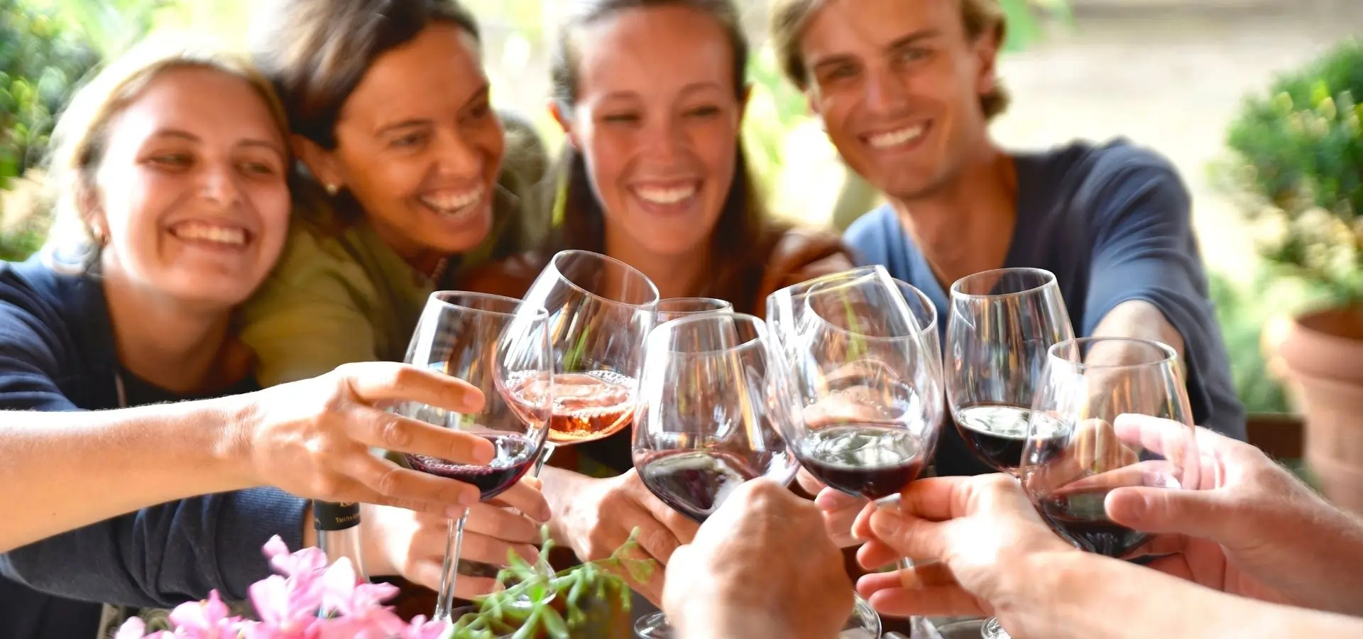 Guests gathering to share a Tuscan meal and wine