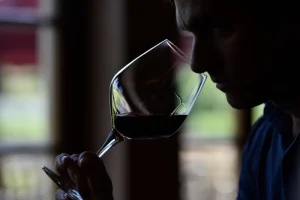 Winemaker guiding the guests on experiencing the bouquet of the wine before tasting
